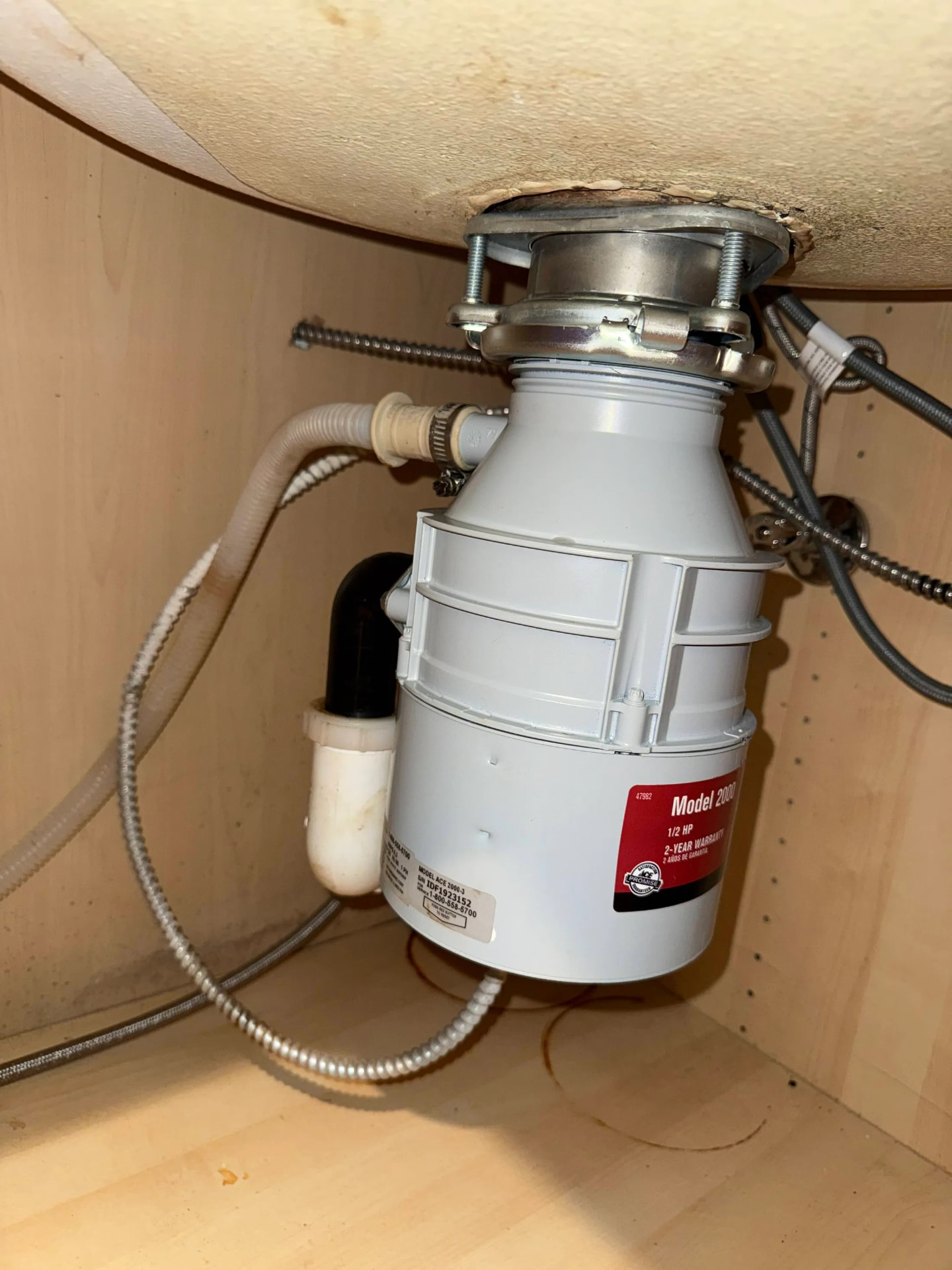 Garbage Disposal Installation being carried out by a Seb Home Services technician